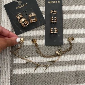 Gold rings set and 2 collar pin brooch , spikes and skull